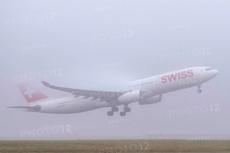 Swiss aircraft, HB-JHE Airbus A330-300, departure in fog, Zürich Kloten, Switzerland