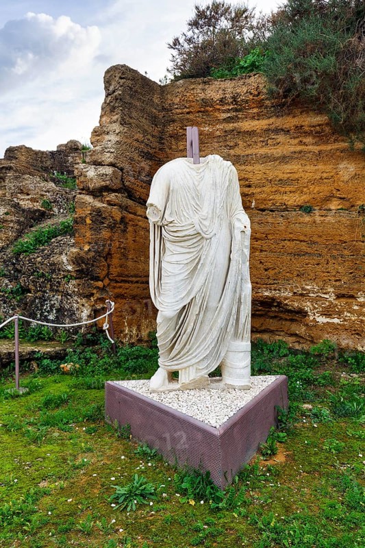 Headless statue, Togati statue, male figure in toga, Roman upper class, marble statue, Valley of the Temples, Agrigento, Sicily, Italy