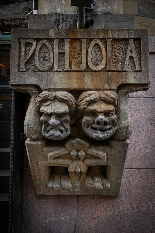 Trolls, stone figures from Kalevala, art nouveau architecture, Pohjola insurance building, Alexanterinkatu, main shopping street in the city center, Helsinki, Finland