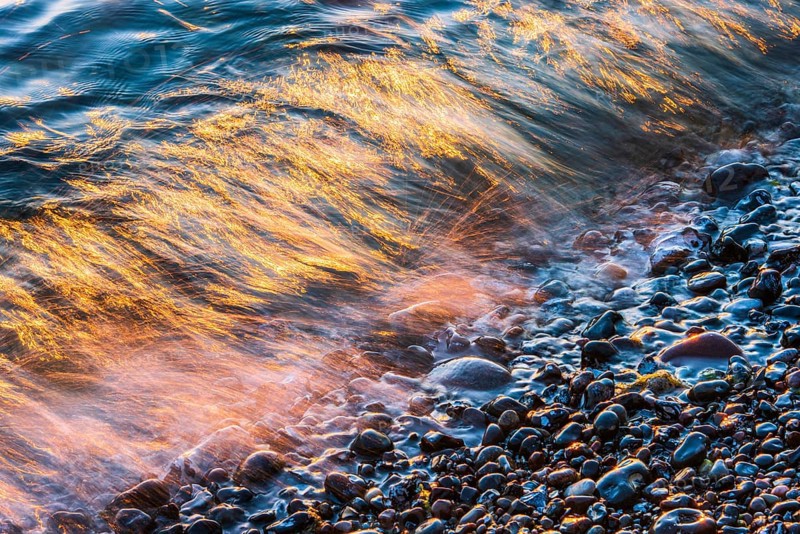 Wave play at sunrise on the chalk coast in Jasmund National Park, Rügen, Sassnitz, Mecklenburg-Western Pomerania, Germany