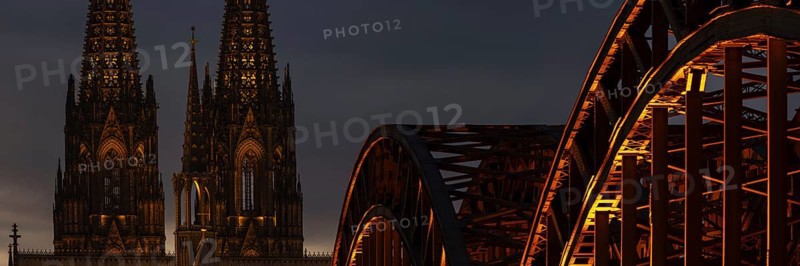 Evening atmosphere, Cologne Cathedral illuminated with LED lamps and the Hohenzollern Bridge, Cologne, North Rhine-Westphalia, Germany