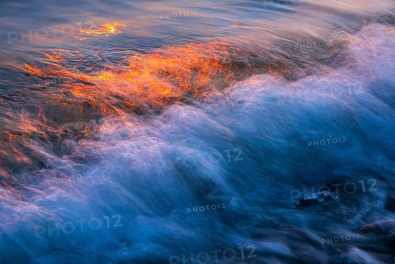 Wave play at sunrise on the chalk coast in Jasmund National Park, Rügen, Sassnitz, Mecklenburg-Western Pomerania, Germany