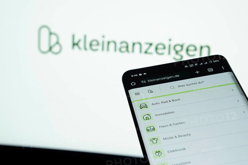 Dhaka, Bangladesh- 03 July 2025: Smartphone displaying Kleinanzeigen web interface against Kleinanzeigen logo background