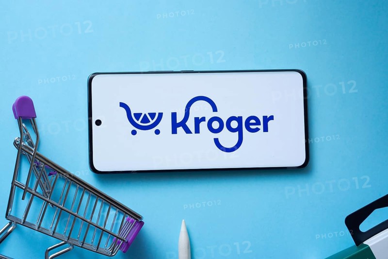 Dhaka, Bangladesh- 03 July 2025: Smartphone displaying Kroger logo with shopping cart on a blue background