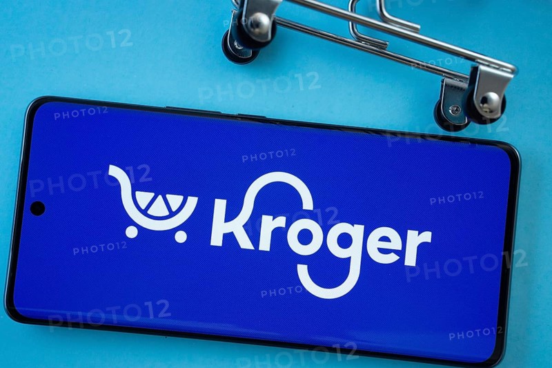Dhaka, Bangladesh- 03 July 2025: Smartphone screen showing the Kroger logo with shopping cart wheels on a blue background