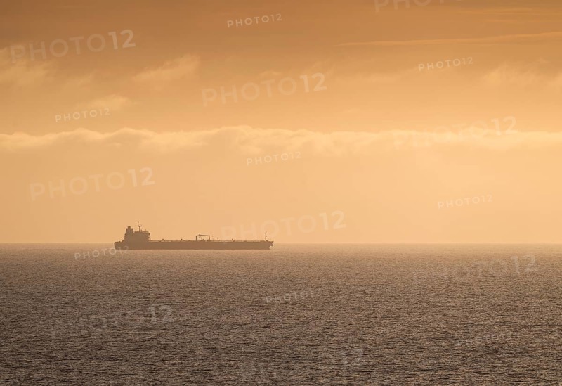 Silhouette, cargo ship, evening light, Baltic Sea