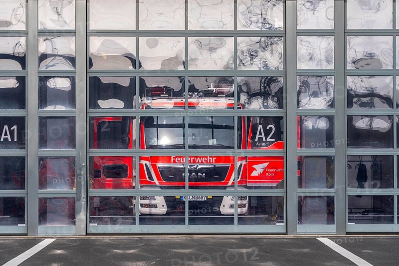 Fire department, fire station, modern guard, silver façade, glass gates, emergency vehicle, fire and rescue station 10, Gummersbacher Straße, Cologne, North Rhine-Westphalia, Germany