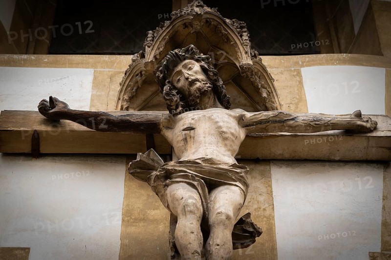 Christ sculpture from the former monastery church of S. Johannes Baptistam above portal of the monastery church, Blaubeuren Abbey, Swabian Jura, Baden-Württemberg, Germany