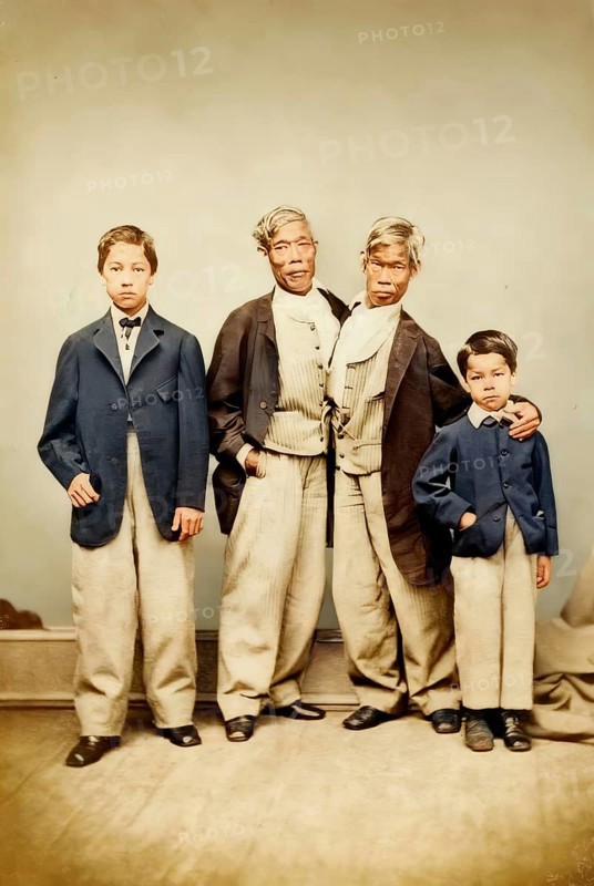Chang and Eng Bunker, 1811–1874, known as the Siamese Twins, with two children, digitally edited according to a photograph by Germon, 1869