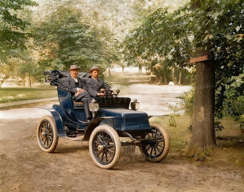 Thomas Alva Edison and William Billy Bee in Detroit Electric automobile on Edge Hill Avenue in Llewellyn Park, 1911, digitally edited