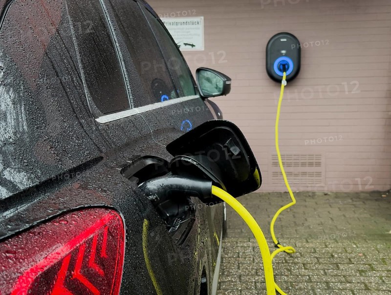 An e-car is charged at a wallbox, Wuppertal, Germany