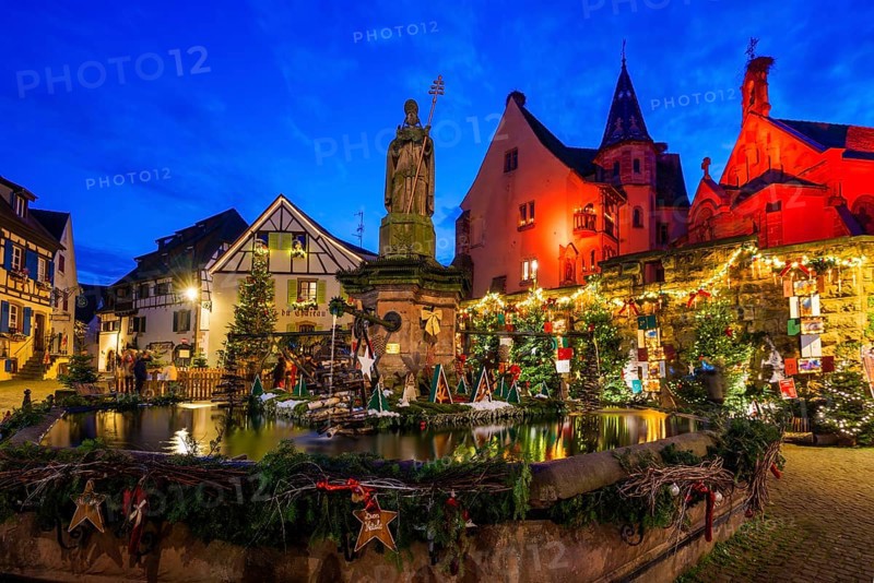 Houses illuminated and decorated for Christmas, Christmas market, blue hour, Eguisheim, Haut-Rhin department, Grand Est region, Alsace, France