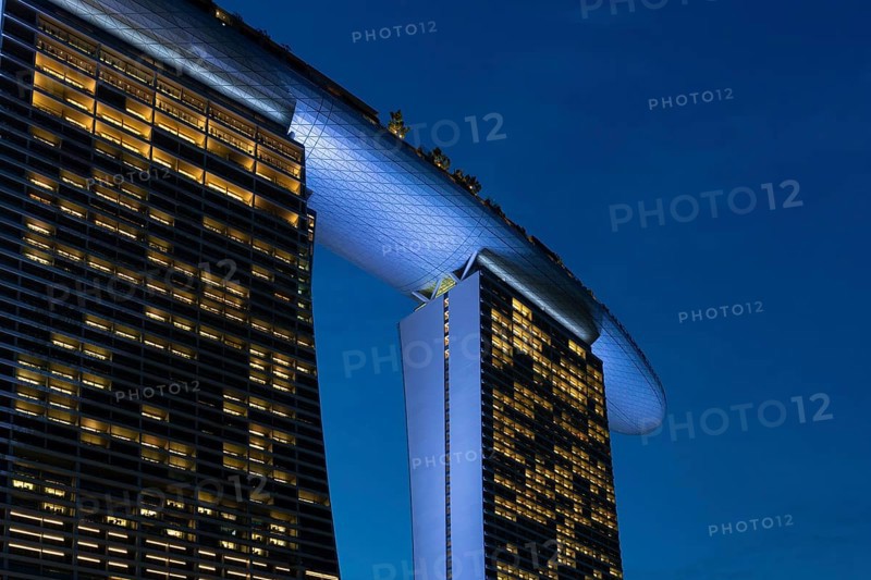 Marina Bay Sands, MBS, luxury 5-star hotel and integrated resort illuminated at dusk in Downtown Core of the city Singapore, Southeast Asia