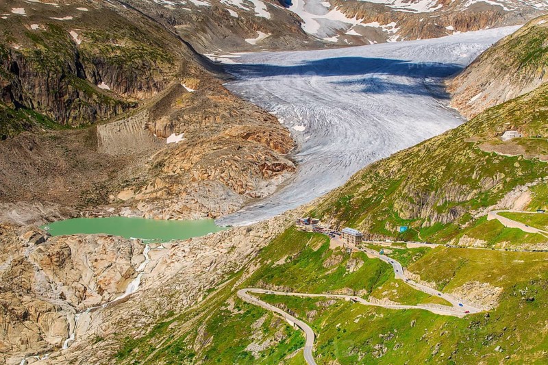 View of the Rhone Glacier, Belvédère Hotel, and Furka Pass on a summer day, highlighting climate change and global warming, Oberwald, Goms, Valais Canton, Switzerland