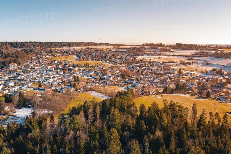 Snowy village landscape with adjacent forest and soft colors, Hallwangen, Freudenstadt district, Germany