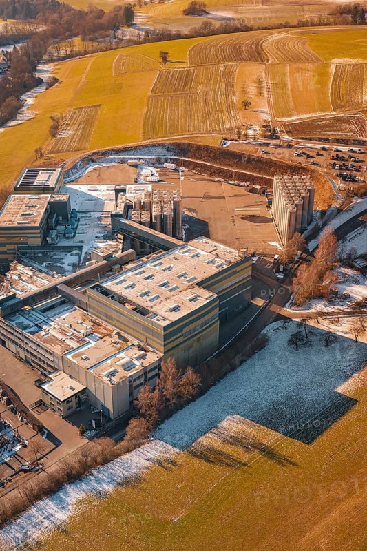 Industrial site in wintry snowy fields and simple countryside, Hallwangen, Freudenstadt district, Germany