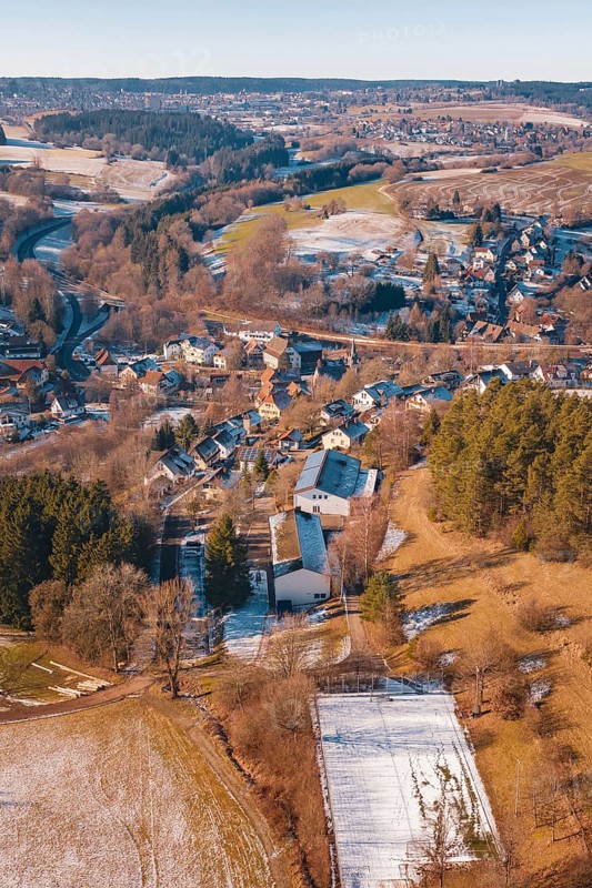 Winter scene with a village and adjacent fields in a wooded region, Aach, Dornstetten, Freudenstadt district, Germany