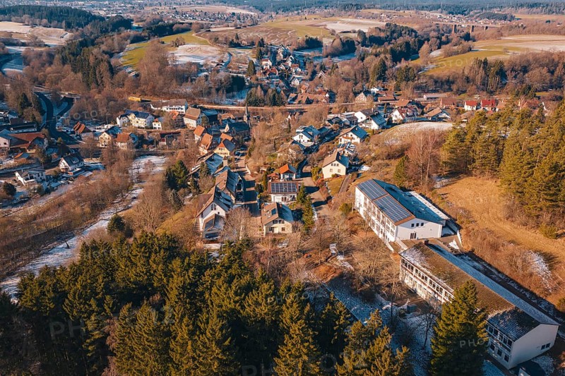 Panoramic view of a snowy village nestled in a hilly forest landscape, Aach, Dornstetten, Freudenstadt district, Germany
