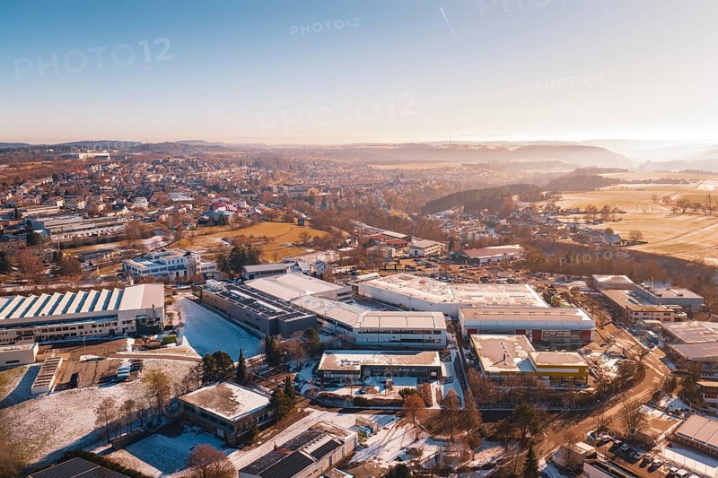 Aerial view of a wintery cityscape with buildings and fields in morning light, Dornstetten, Freudenstadt district, Germany