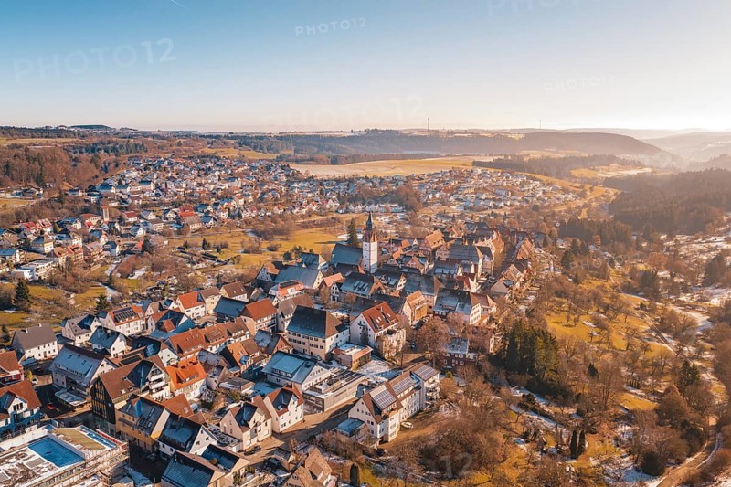 Picturesque winter town with historic buildings and surrounding hills, Dornstetten, Freudenstadt district, Germany