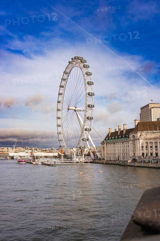 Cityscape with Ferris wheel on riverbank in good weather, London Eye, London, United Kingdom