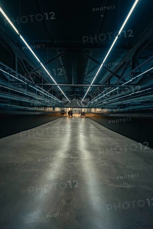 Futuristic corridor with strong lighting and reflections, Tate Modern of Art, Lodon, United Kingdom