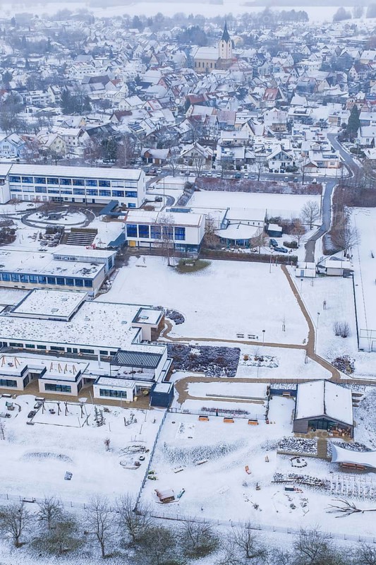 Village with snow-covered roofs and roads, modern and historic building, Empfingen, Freudenstadt district, Germany