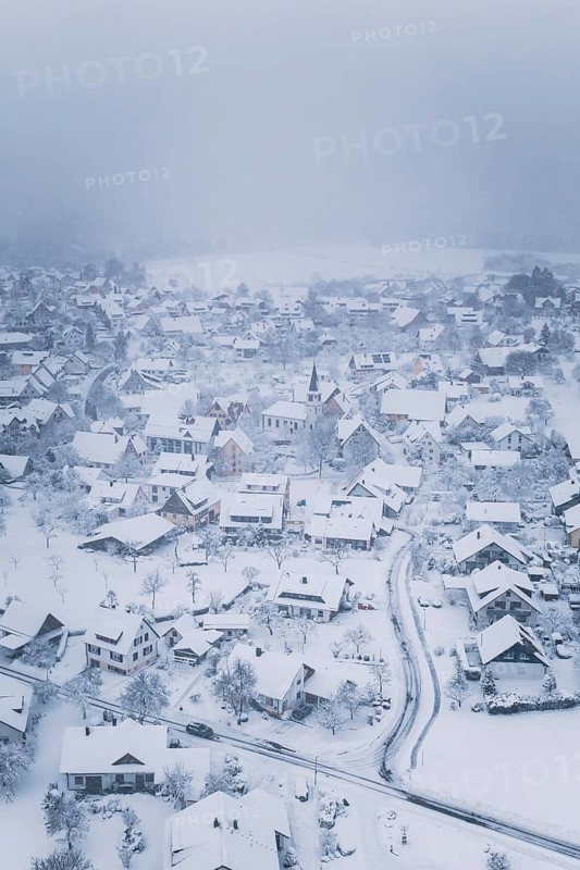 A wintry village with snow-covered houses and peaceful atmosphere, Schopfloch, Freudenstadt district, Germany