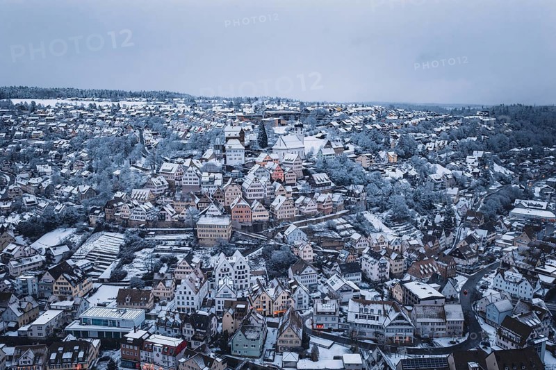 Snowy urban view with densely packed houses and winter views, Altensteig, Calw district, Germany