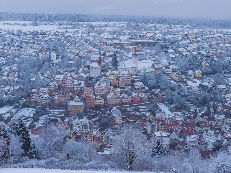 Snowy city landscape with colorful half-timbered houses and winter flair, Altensteig, Calw district, Germany