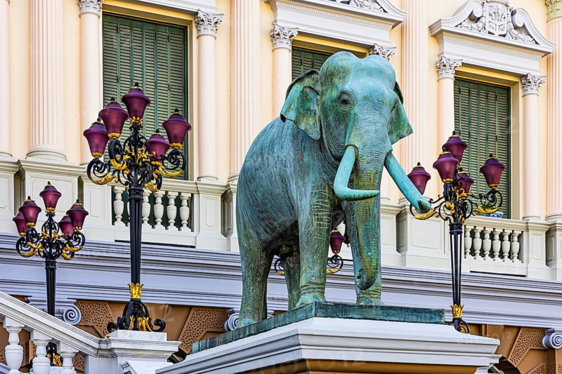 The Grand Royal Palace, an elephant statue and multi-armed lanterns decorate the side entrance of the Chakri Maha Prasad throne hall, Phra Nakhon, Bangkok, Thailand's metropolis, Thailand