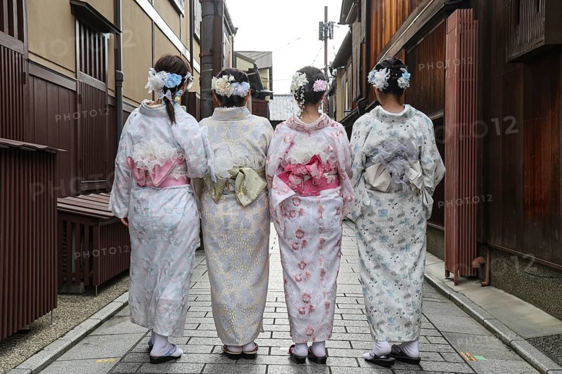 Four woman in kimonos walk through Nakamachi Street in Gion, Gion, Kyoto, Japan