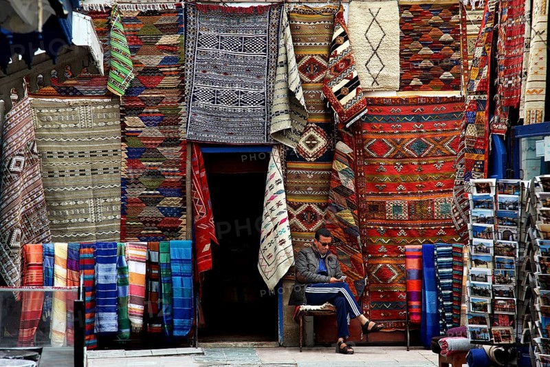 Traditional souk with colorful carpets and textiles in the old town, Essaouira, null, Morocco