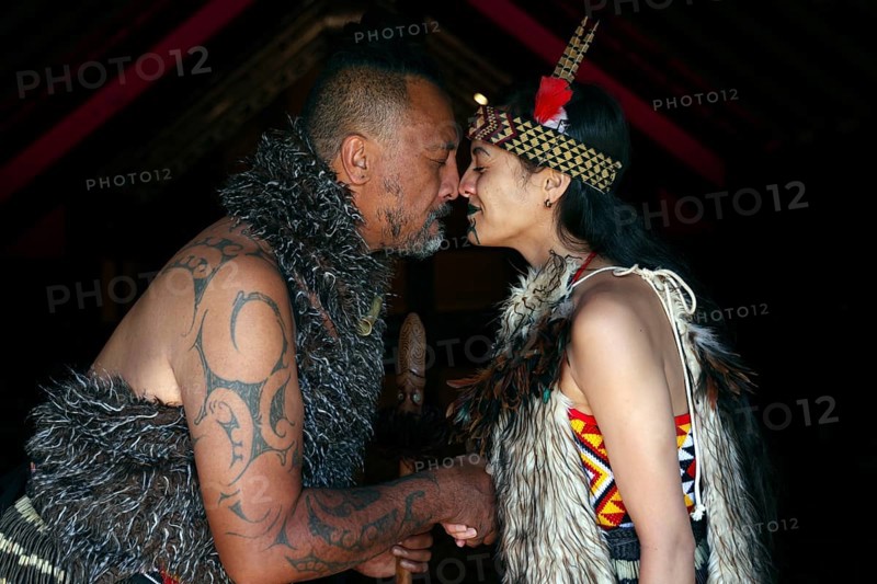 Hongi ceremony between two Maori in traditional dress, Rotorua, Te Puia, New Zealand