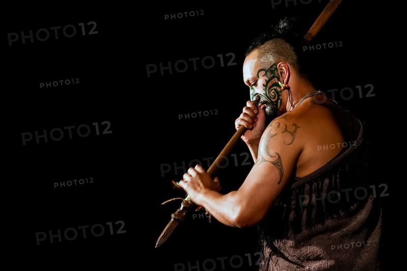 Maori warriors with traditional face painting and tattoo at a cultural performance in Rotorua, Rotorua, Bay of Plenty, New Zealand