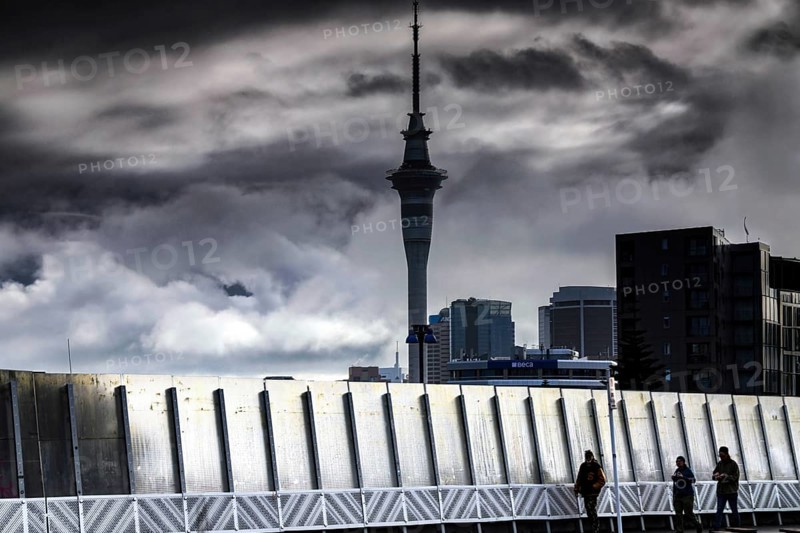 View of Karangalape Road with Sky Tower and dramatic sky, Auckland, null, New Zealand