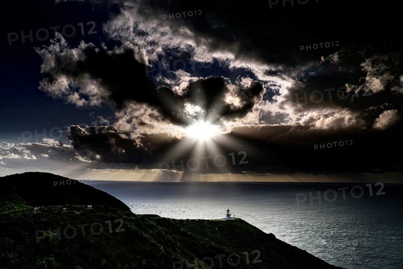 Mystical coastal landscape near Cape Reinga with dramatic sunset and clouds, Cape Reinga, Northland, New Zealand