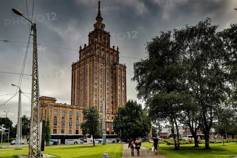 Latvian Academy of Sciences in Riga on a cloudy day with surrounding greenery, Riga, Latvia