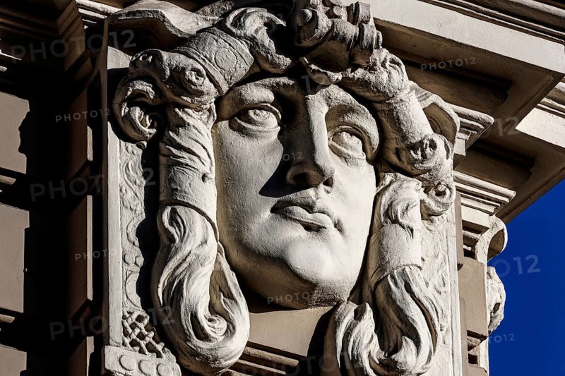 Detail of an Art Nouveau building on Elizabeth Street with a distinctive stone head, Riga, Vidzeme, Latvia