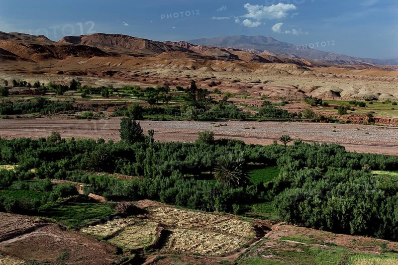 Extensive panoramic view of Ait Benhaddou with green valleys and surrounding mountains, Ait Benhaddou, Morocco