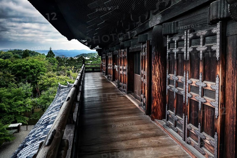 Sanmon wooden main gate of Nanzen-ji Temple in Kyoto with lush nature in the background, Kyoto, Okazaki, Japan