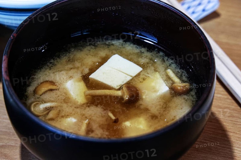 Spicy miso soup with tofu and mushrooms in a dark bowl, Matsumoto, Japan