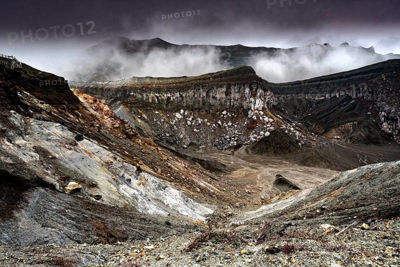 Smoking crater in the midst of steep, barren rocky landscape, Aso, Kumamoto, Japan