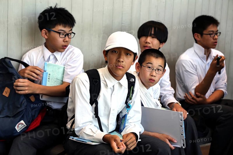 Students relax at Hiroshima Peace Museum after visiting, Hiroshima, Japan