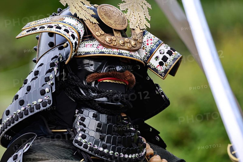 A proud samurai in traditional armor with Himeji Castle in the background, Himeji, Japan
