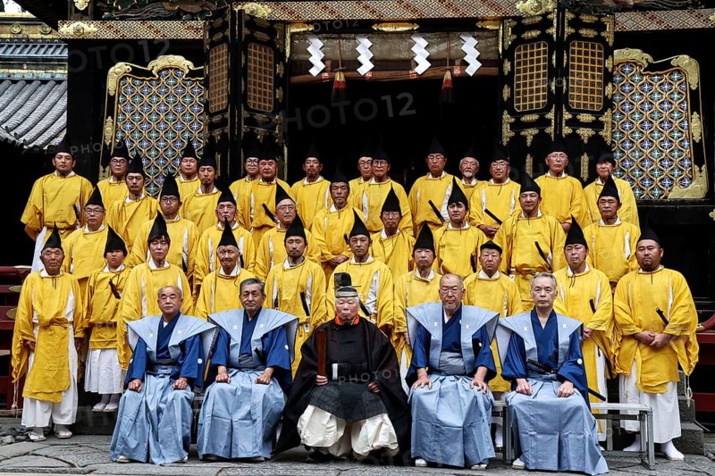 Ceremonial group photo of Shinto priests wearing traditional dress in front of Toshogu Shrine, Nikko, Tochigi, Japan