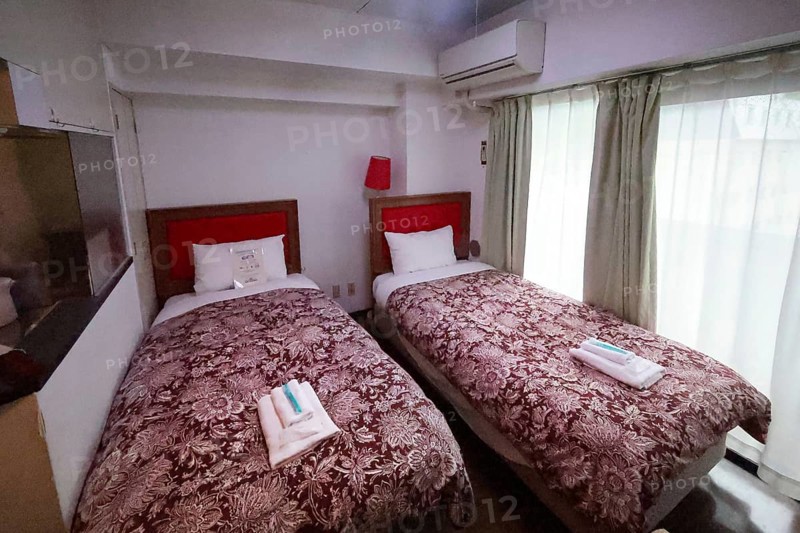 Hotel room with twin beds, brown blankets and red headboard, Nikko, null, Japan