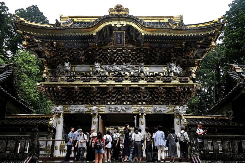 Opulently decorated entrance of the Yomeimon Gate at Toshogu Shrine in Nikko, Nikko, Japan