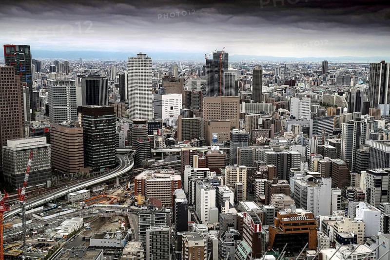Panoramic view of Umeda skyscrapers under cloudy sky, Osaka, Umeda, Japan