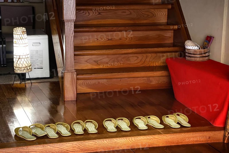 Shoes in the entrance area of a ryokan in Yamanouchi, Yamanouchi, Japan